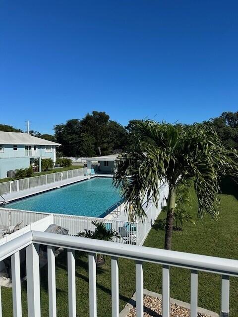 40 High Point Road, Unit D202 Tavernier, FL 33070 - Photo 3 of 28 a view of a balcony with a swimming pool