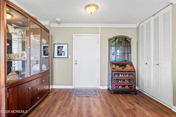 a view of room with window and wooden floor