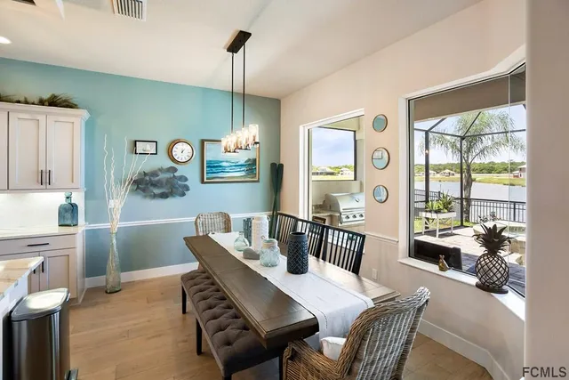 a view of a dining room with furniture window and outside view