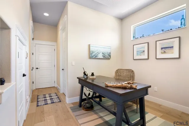a view of a workspace with furniture and cabinet