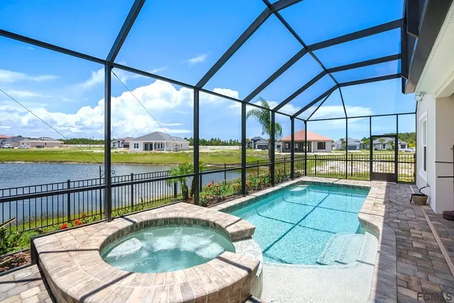 a view of swimming pool with a patio