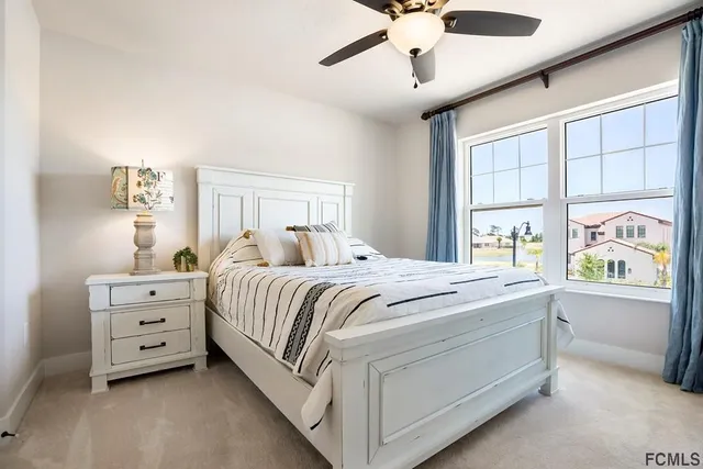 a bed room with a bed and a window