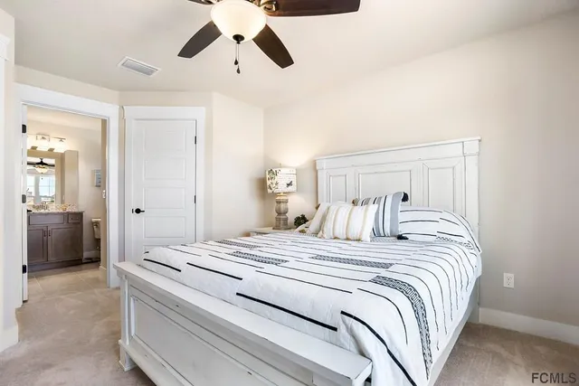 a bedroom with a bed and cabinets