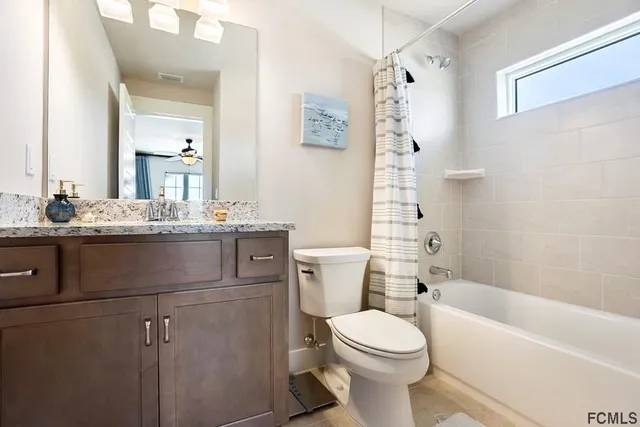 a bathroom with a sink a toilet and a bathtub