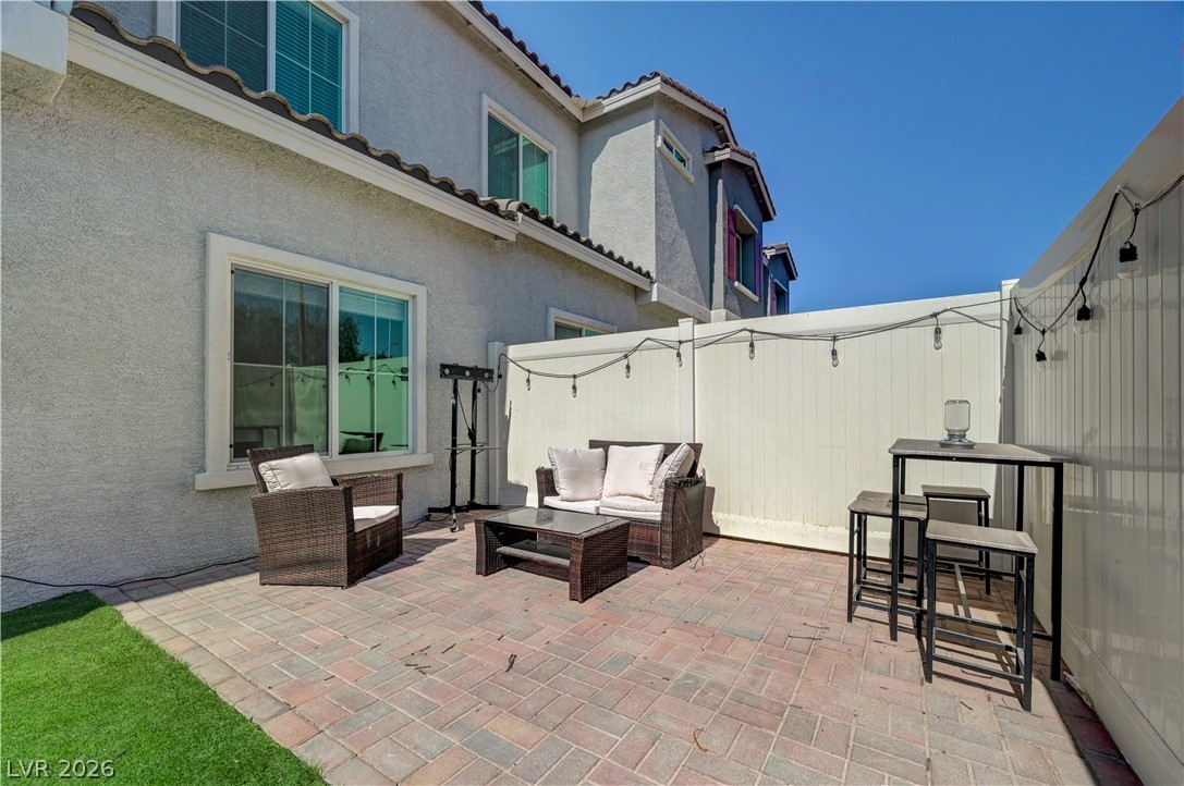 7204 North Decatur Boulevard, Unit 3 North Las Vegas, NV 89084 - Photo 39 of 48 Brick pavers define this private patio area, ideal for relaxed outdoor gatherings.