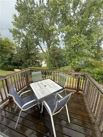 a view of a chairs and table on the deck