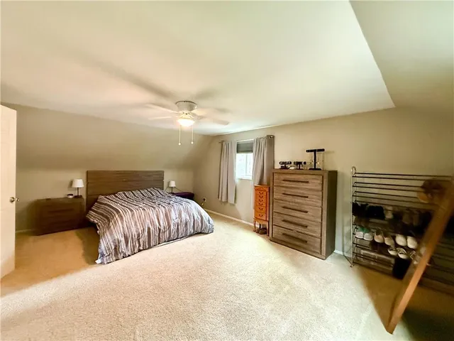 a bedroom with a bed and dresser