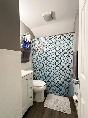 a bathroom with a toilet and a sink