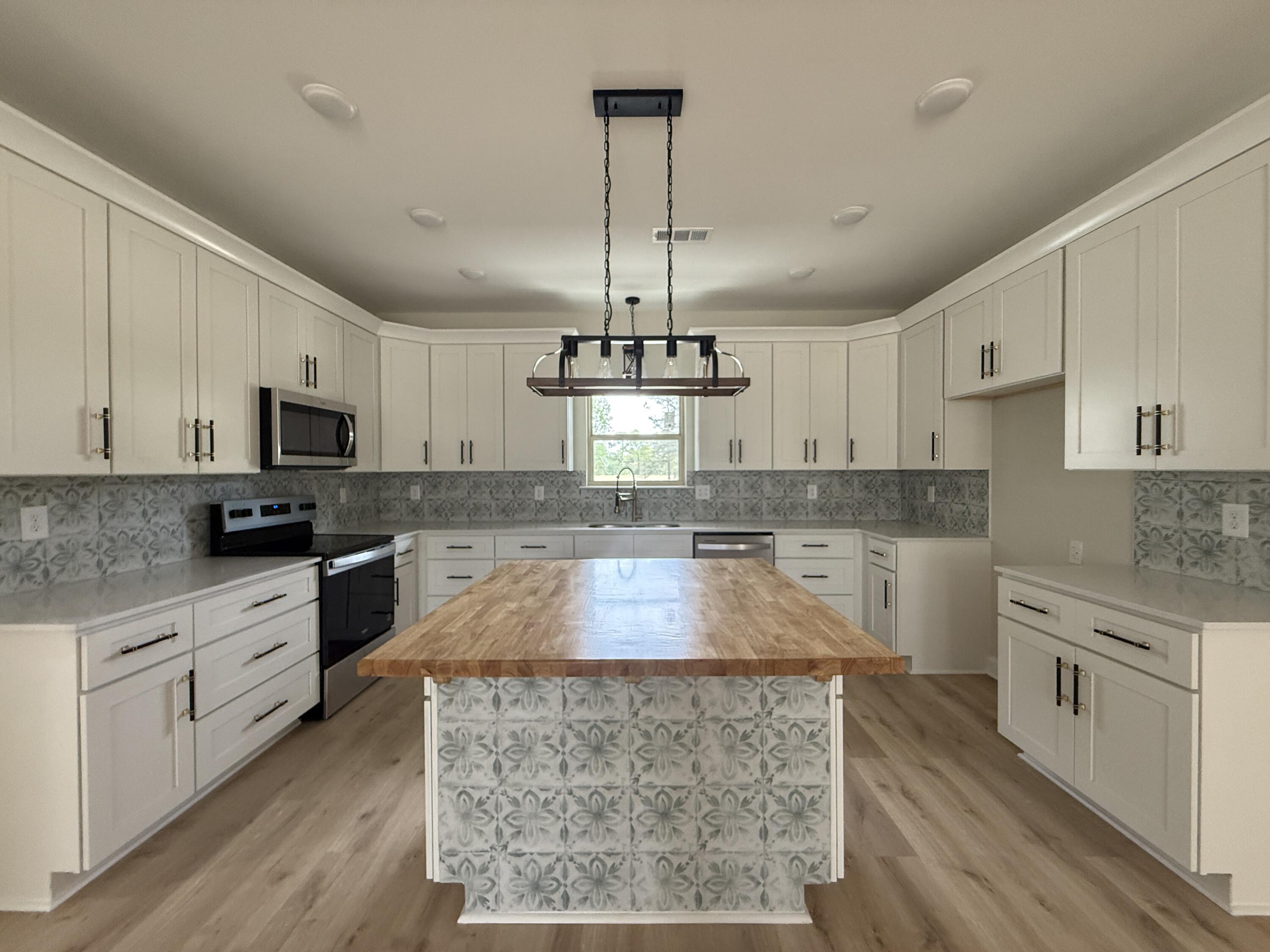 1041 Fairway Ridge Drive Wrens, GA 30833 - Photo 4 of 10 Kitchen Breakfast Bar with Butcher Block Top