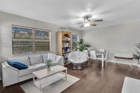 a room with wooden floor and furniture