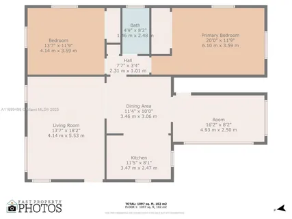 a kitchen with white cabinets and refrigerator