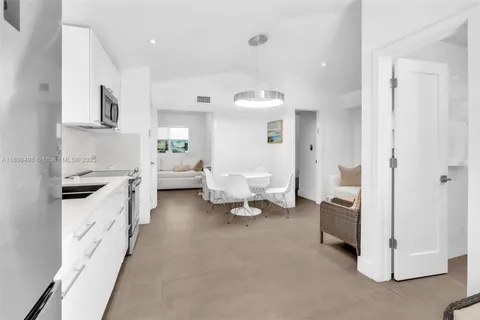 a bedroom with two beds and a window