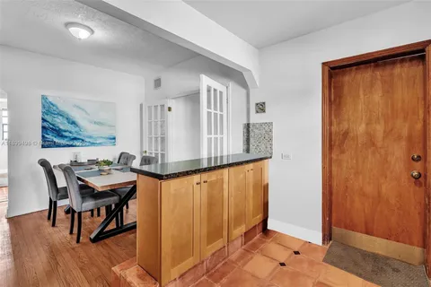 a balcony with table and chairs