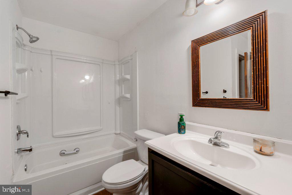 711 Ridge Road Mount Airy, MD 21771 - Photo 24 of 47 a bathroom with a sink a toilet and shower