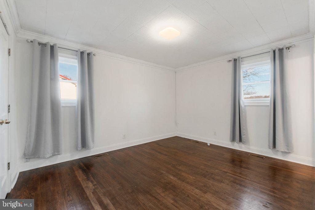 711 Ridge Road Mount Airy, MD 21771 - Photo 27 of 47 an empty room with wooden floor and windows