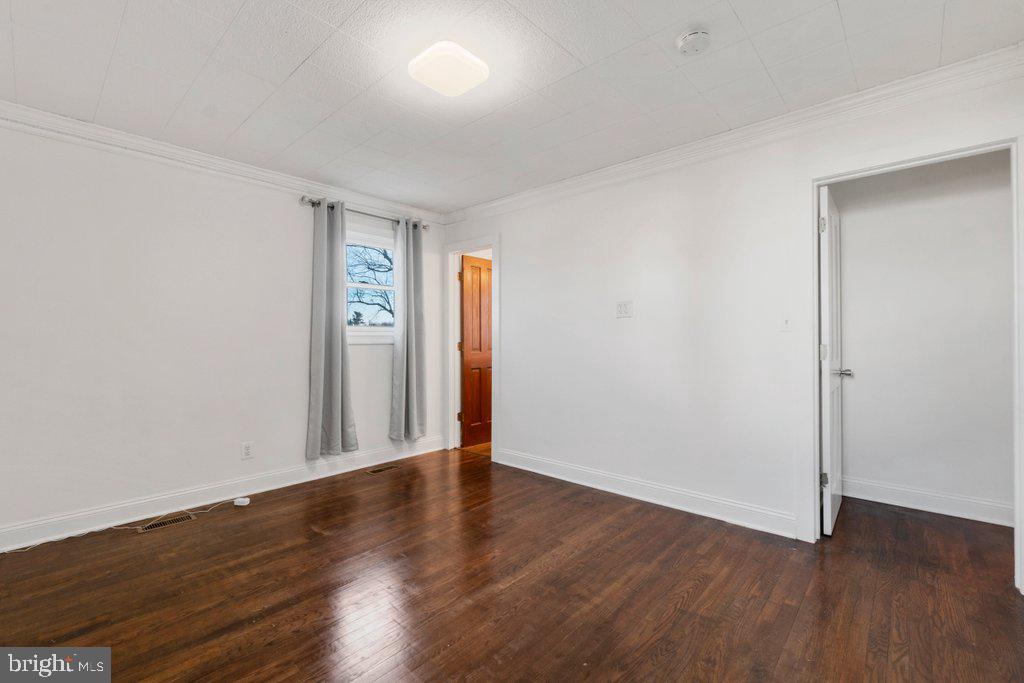 711 Ridge Road Mount Airy, MD 21771 - Photo 28 of 47 a view of an empty room with wooden floor
