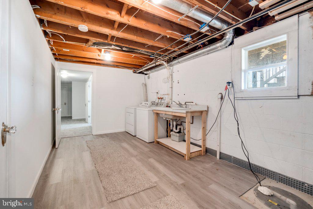 711 Ridge Road Mount Airy, MD 21771 - Photo 38 of 47 a view of a room with wooden floor and windows