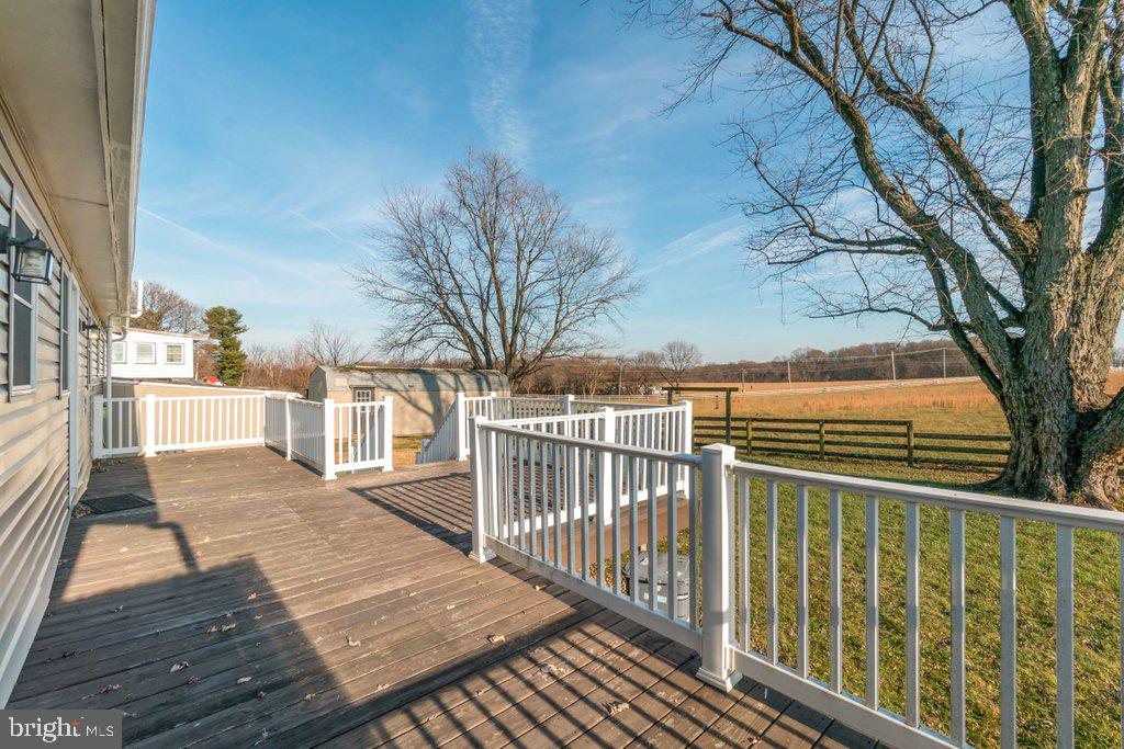 711 Ridge Road Mount Airy, MD 21771 - Photo 42 of 47 a view of a balcony with wooden floor and fence