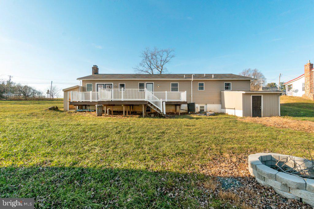 711 Ridge Road Mount Airy, MD 21771 - Photo 47 of 47 a view of a house with pool lawn chairs and a yard