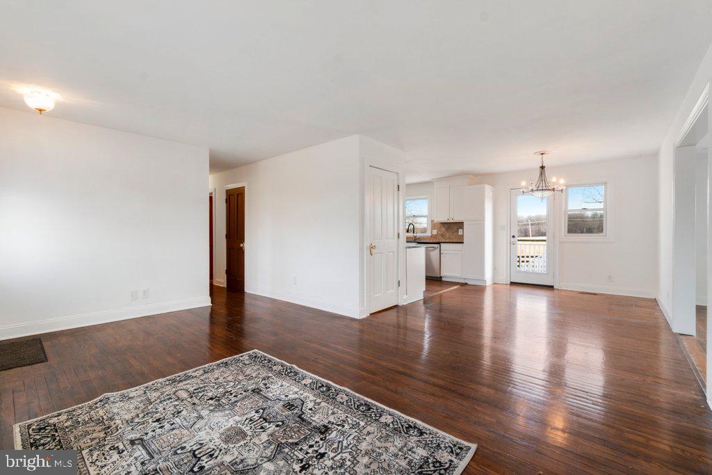 711 Ridge Road Mount Airy, MD 21771 - Photo 7 of 47 a view of a kitchen with a sink and a stove top oven