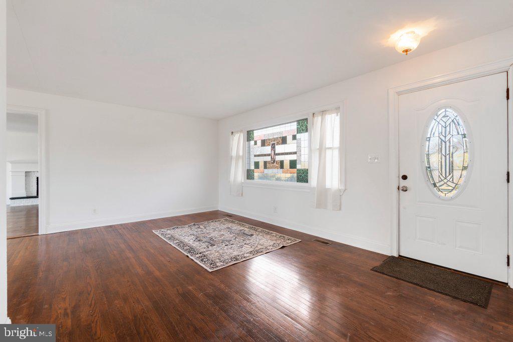 711 Ridge Road Mount Airy, MD 21771 - Photo 8 of 47 an empty room with wooden floor and windows
