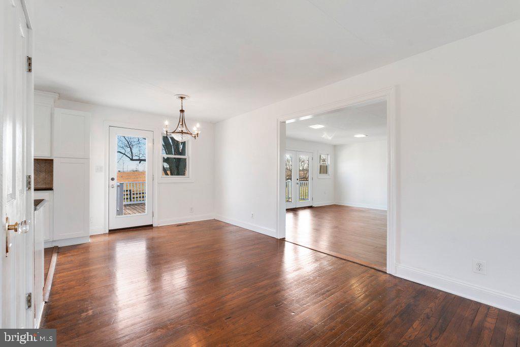 711 Ridge Road Mount Airy, MD 21771 - Photo 10 of 47 a view of a big room with wooden floor and windows