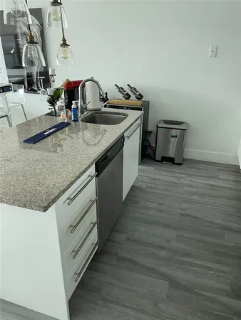 a kitchen with counter space cabinets and appliances