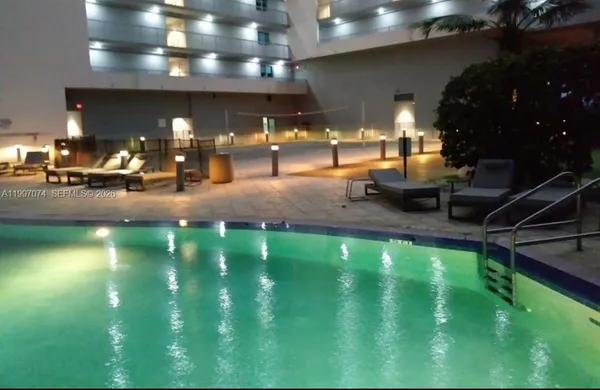 a view of a golf course with a table and chairs
