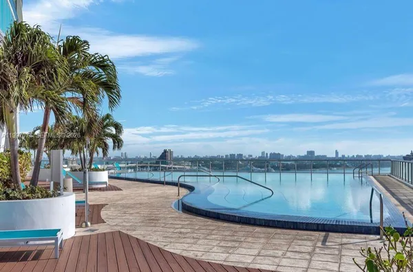 a view of a swimming pool with a patio