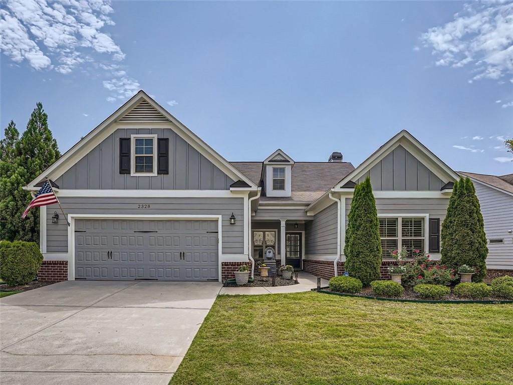2328 Button Head Run Kennesaw, GA 30144 - Photo 1 of 1 a front view of a house with a yard and garage