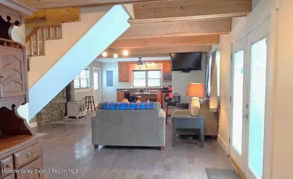 a view of entryway with wooden floor