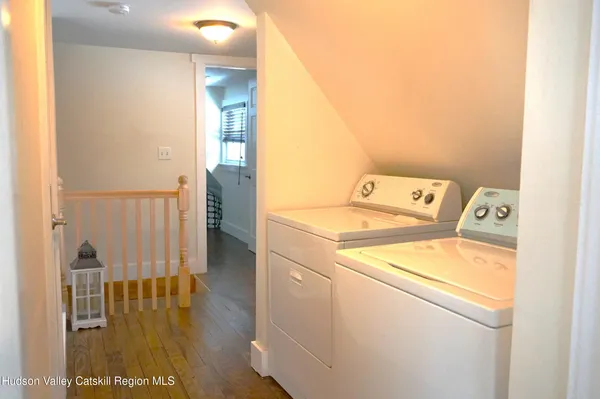 a view of a balcony with wooden floor