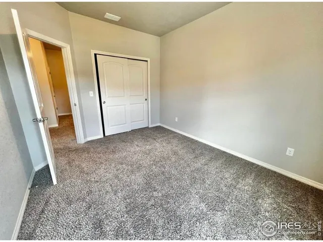 an empty room with a mirror