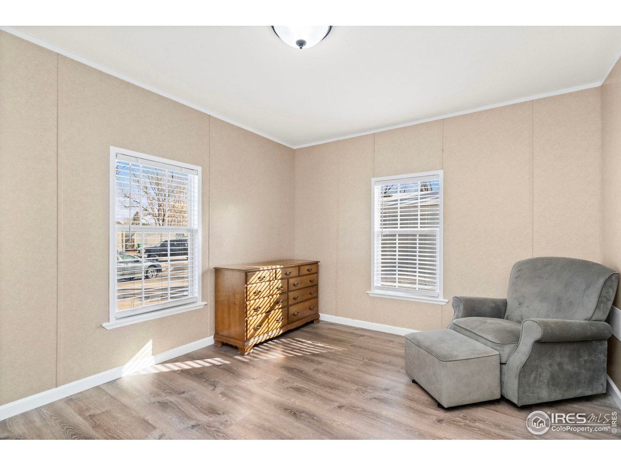 2500 East Harmony Road, Unit 105 Fort Collins, CO 80528 - Photo 11 of 21 a living room with furniture and a window