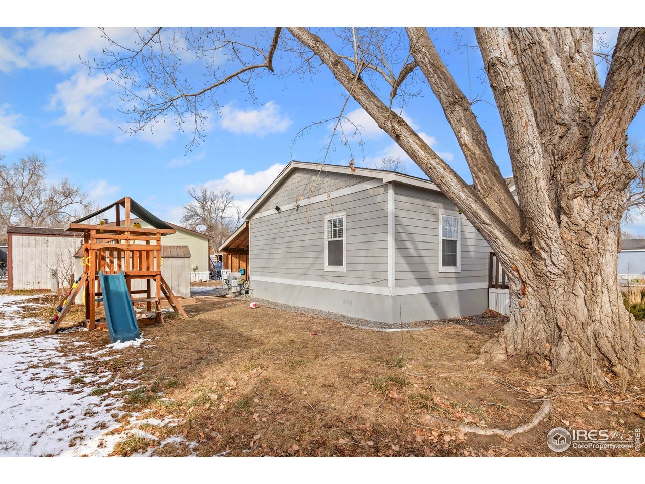2500 East Harmony Road, Unit 105 Fort Collins, CO 80528 - Photo 18 of 21 a view of a house with a yard
