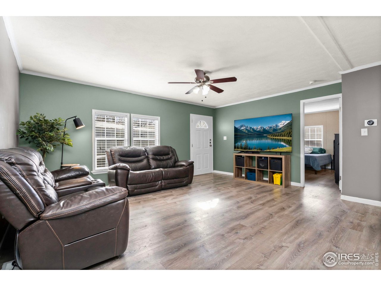 2500 East Harmony Road, Unit 105 Fort Collins, CO 80528 - Photo 5 of 21 a living room with furniture and a flat screen tv