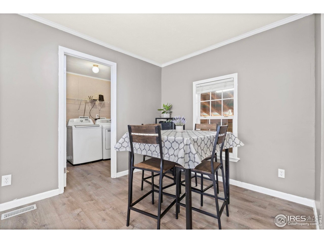 2500 East Harmony Road, Unit 105 Fort Collins, CO 80528 - Photo 7 of 21 a view of a dining room with furniture and wooden floor