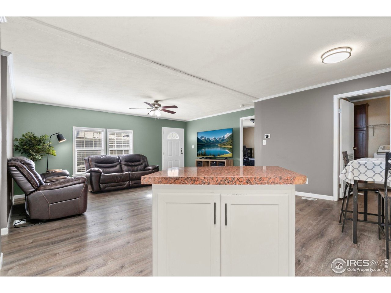 2500 East Harmony Road, Unit 105 Fort Collins, CO 80528 - Photo 8 of 21 a living room with furniture and a flat screen tv