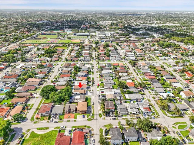 an aerial view of residential building with parking space