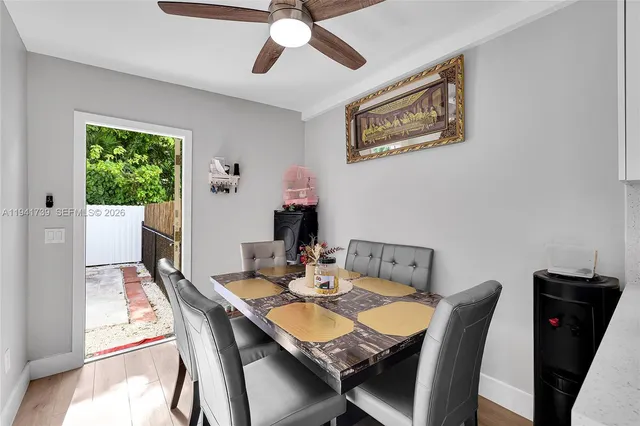 a view of a dining room with furniture window and outside view