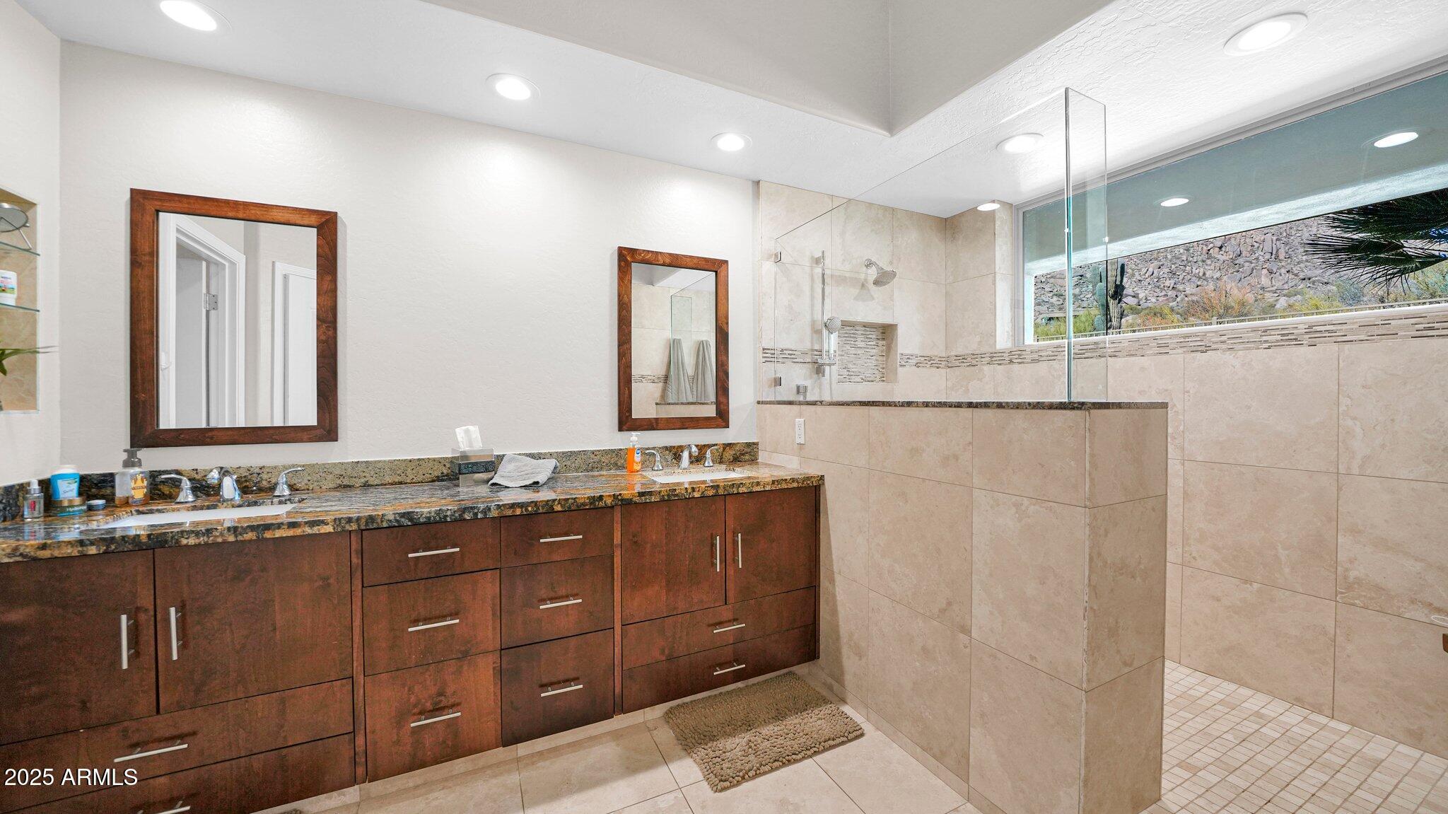 11516 East Ranch Gate Road Scottsdale, AZ 85255 - Photo 20 of 36 a bathroom with double vanity and a mirror