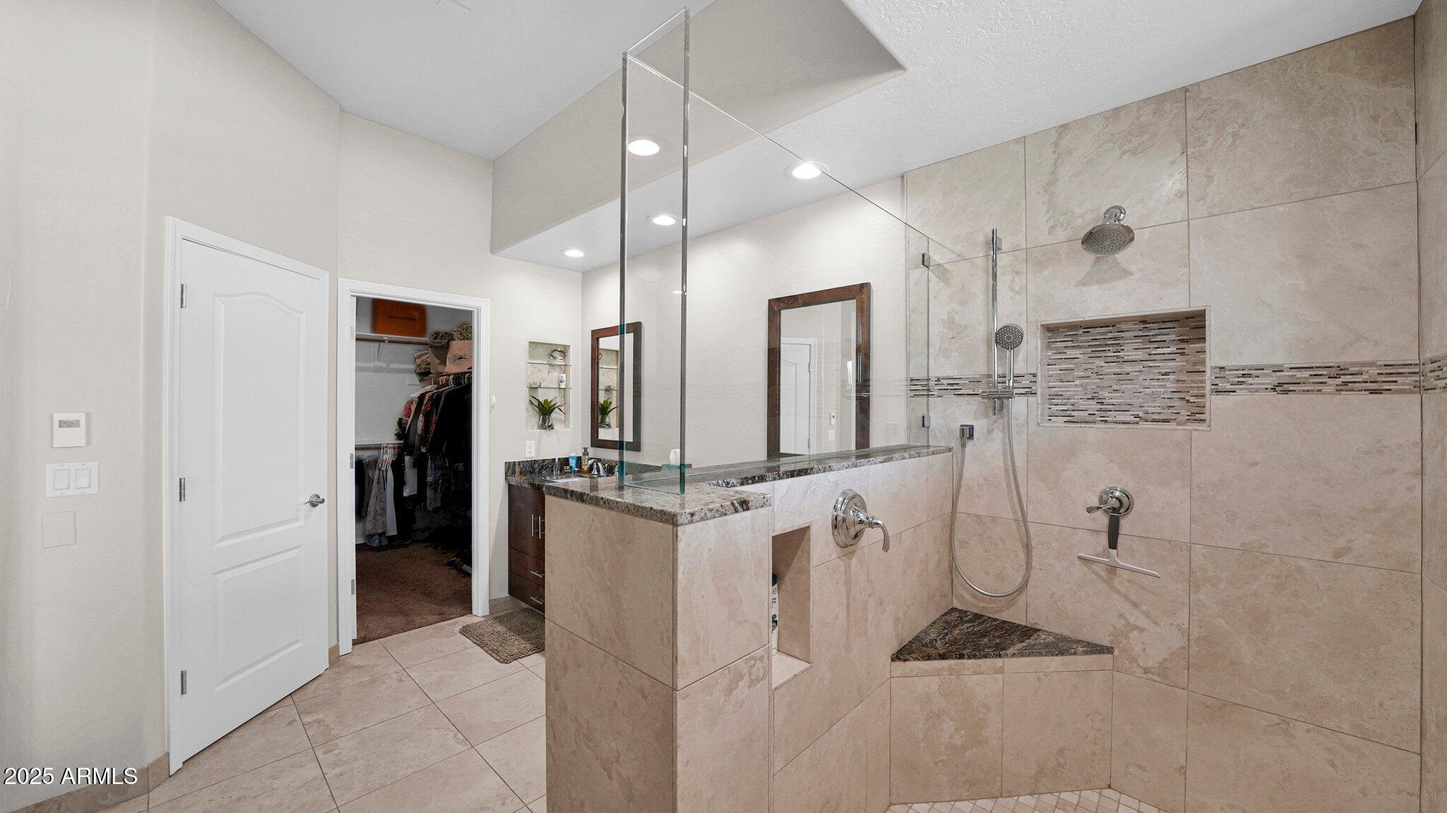 11516 East Ranch Gate Road Scottsdale, AZ 85255 - Photo 21 of 36 a bathroom with a double vanity sink mirror and shower
