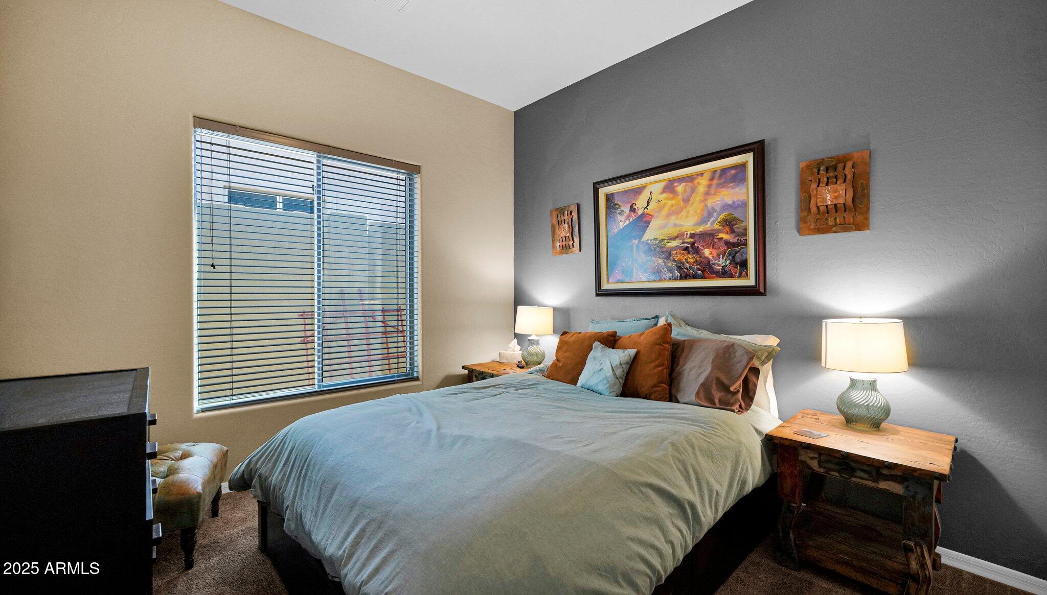 11516 East Ranch Gate Road Scottsdale, AZ 85255 - Photo 23 of 36 a bedroom with a bed and a painting on the wall