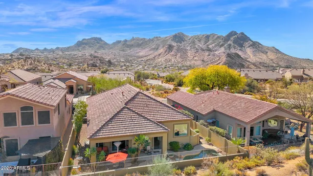 a view of a town with mountains in the background