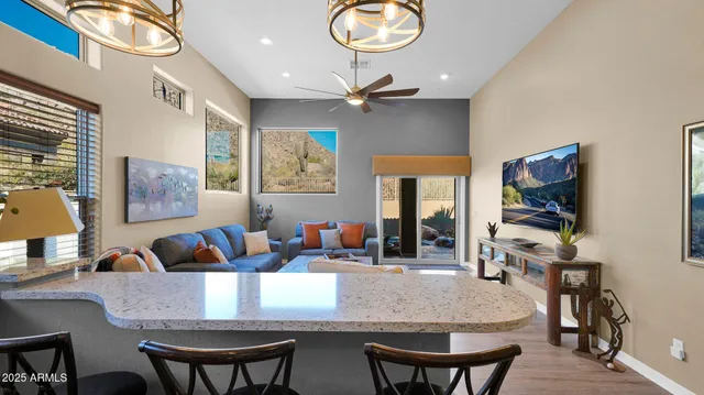 a living room with fireplace furniture and a flat screen tv