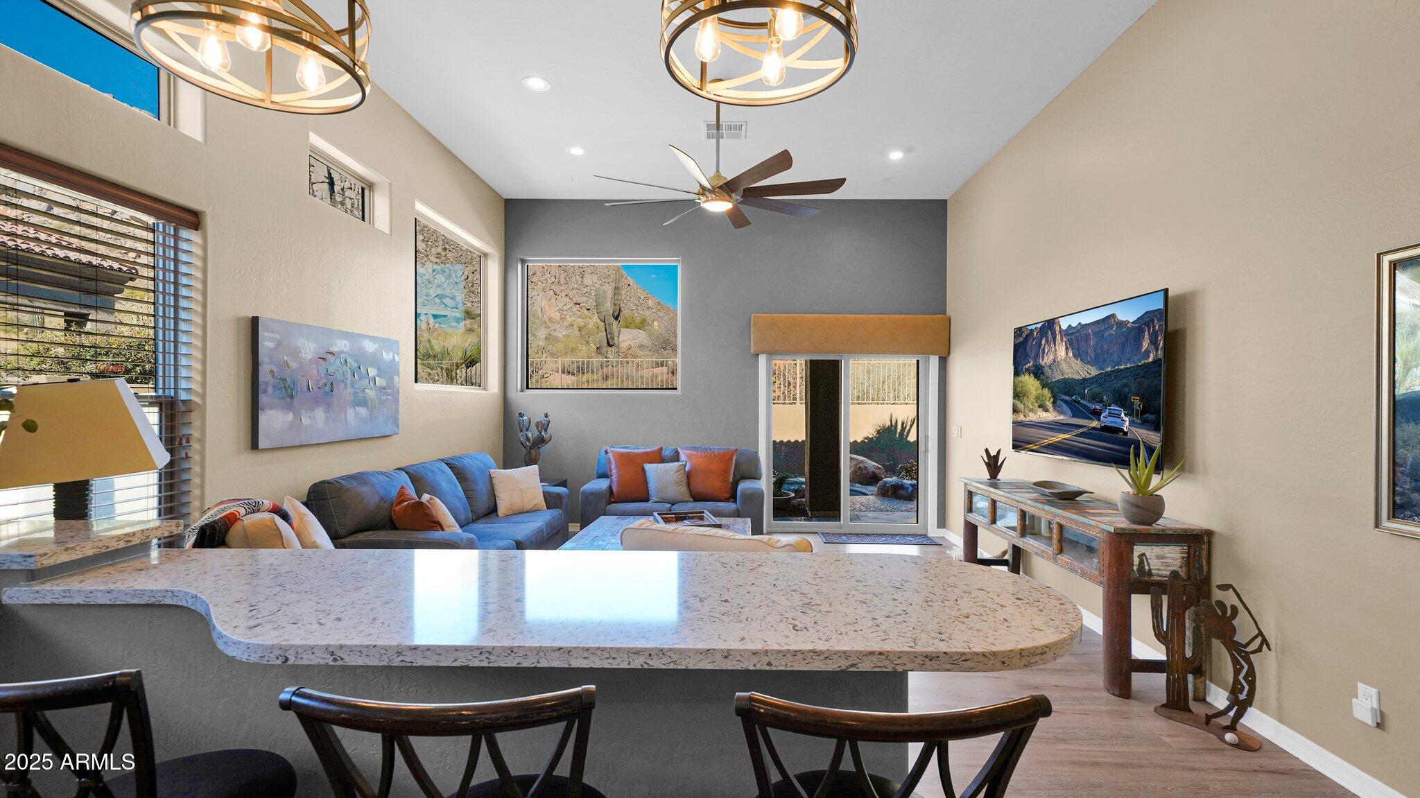 11516 East Ranch Gate Road Scottsdale, AZ 85255 - Photo 6 of 36 a living room with fireplace furniture and a flat screen tv