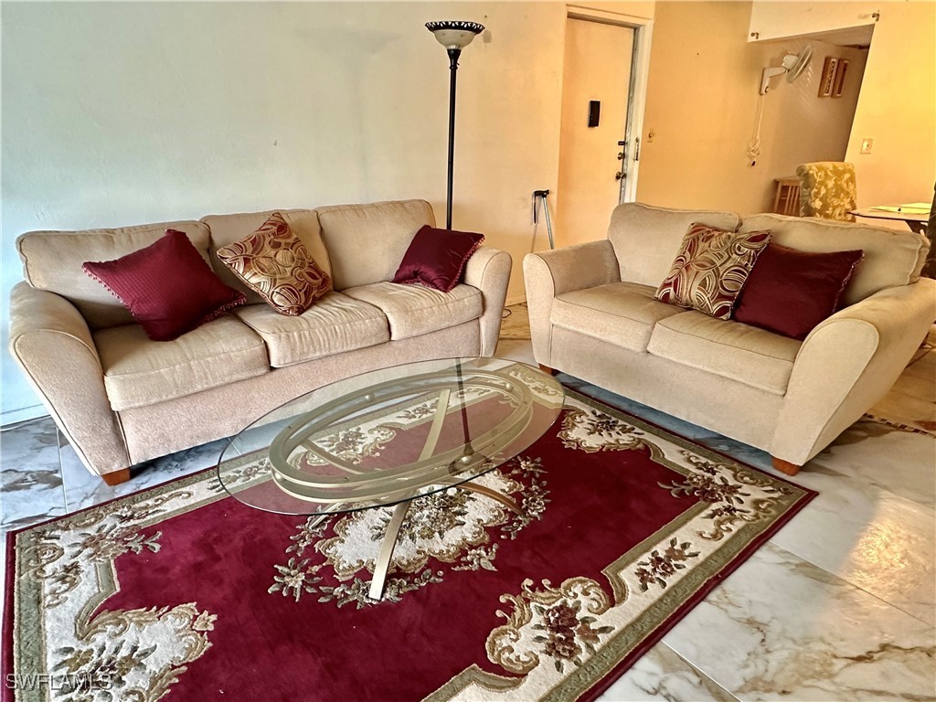 2828 Jackson Street, Unit F7 Fort Myers, FL 33901 - Photo 14 of 49 a living room with furniture and a couch