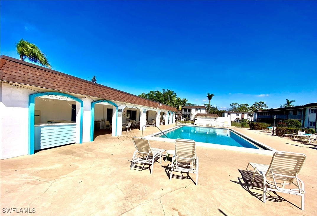 2828 Jackson Street, Unit F7 Fort Myers, FL 33901 - Photo 35 of 49 a view of a patio with swimming pool