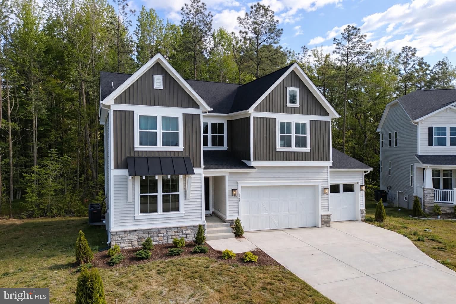 7119 Resolution Way Ruther Glen, VA 22546 - Photo 2 of 79 Charming home nestled in nature's embrace.
