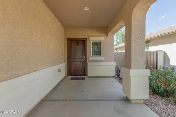 a hallway with a washer and dryer